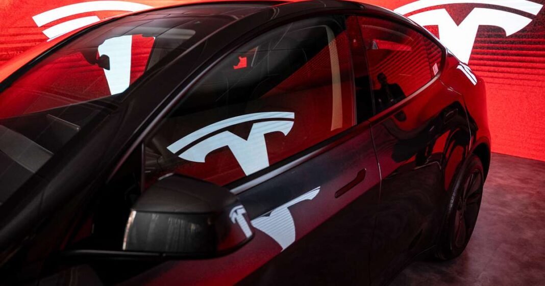 Tesla Share Price Nears Record High as AI Hopes Fuel Rally